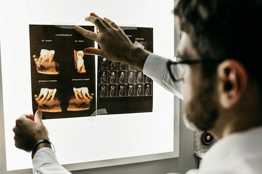 Dentist reviewing dental X-rays