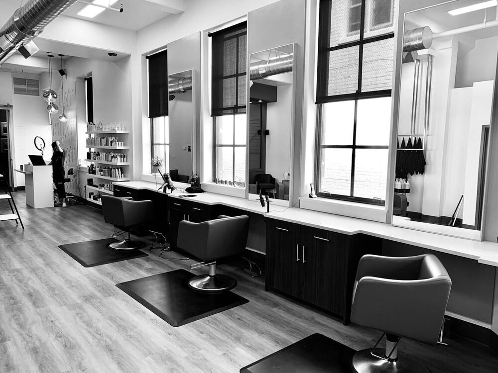 Black and white photo of a bright salon studio